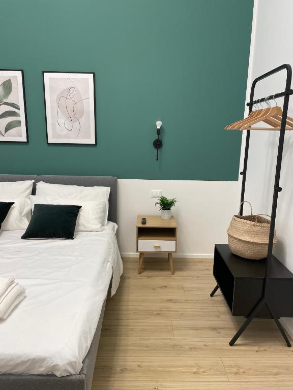 Postel nebo postele na pokoji v ubytování Moor Assarotti Suites - Genova City Center