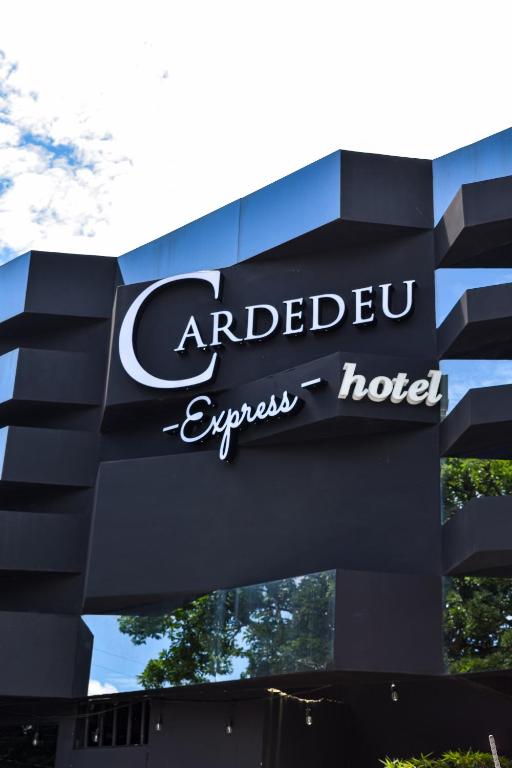 a sign for anadobeexpect hotel on a building at Cardedeu Express Hotel in San Salvador