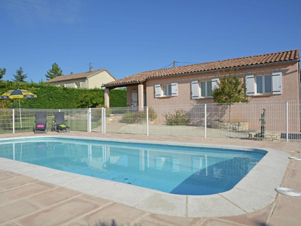 a swimming pool in front of a house at Luxury Villa with Private Pool in Saint Victor de Malcap in Saint-Victor-de-Malcap