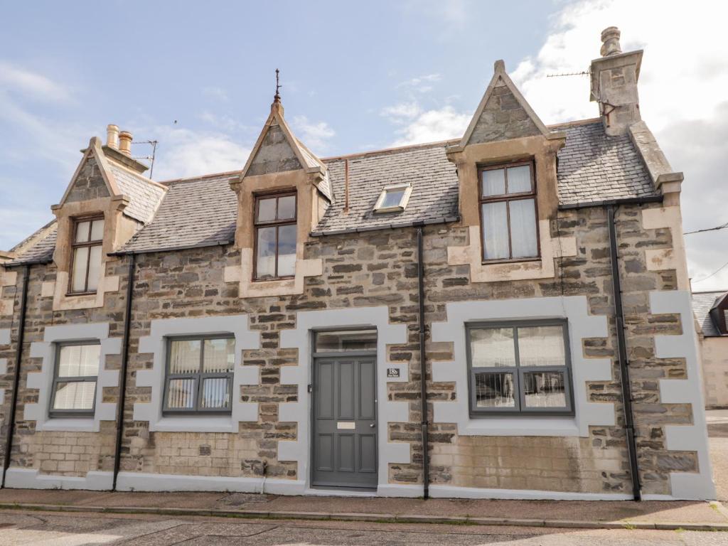 an old stone house in the street at 18b New Street in Buckie