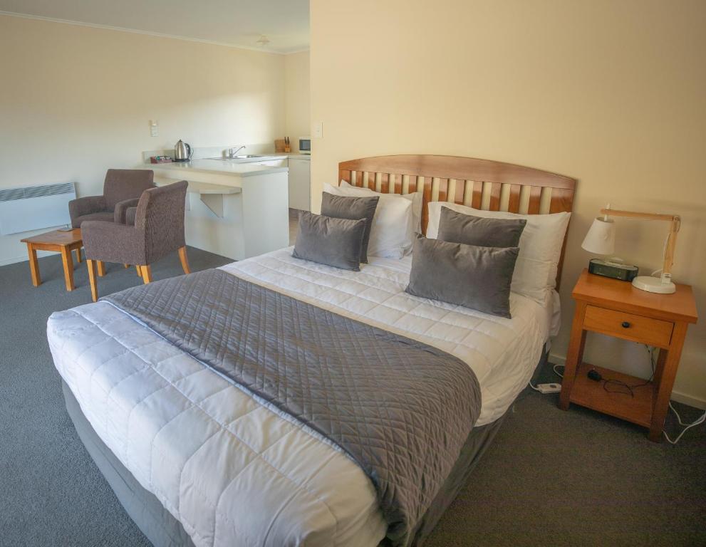 Postel nebo postele na pokoji v ubytování Rainforest Motel