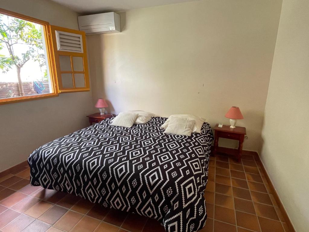 Postel nebo postele na pokoji v ubytování Villa La Tapatia