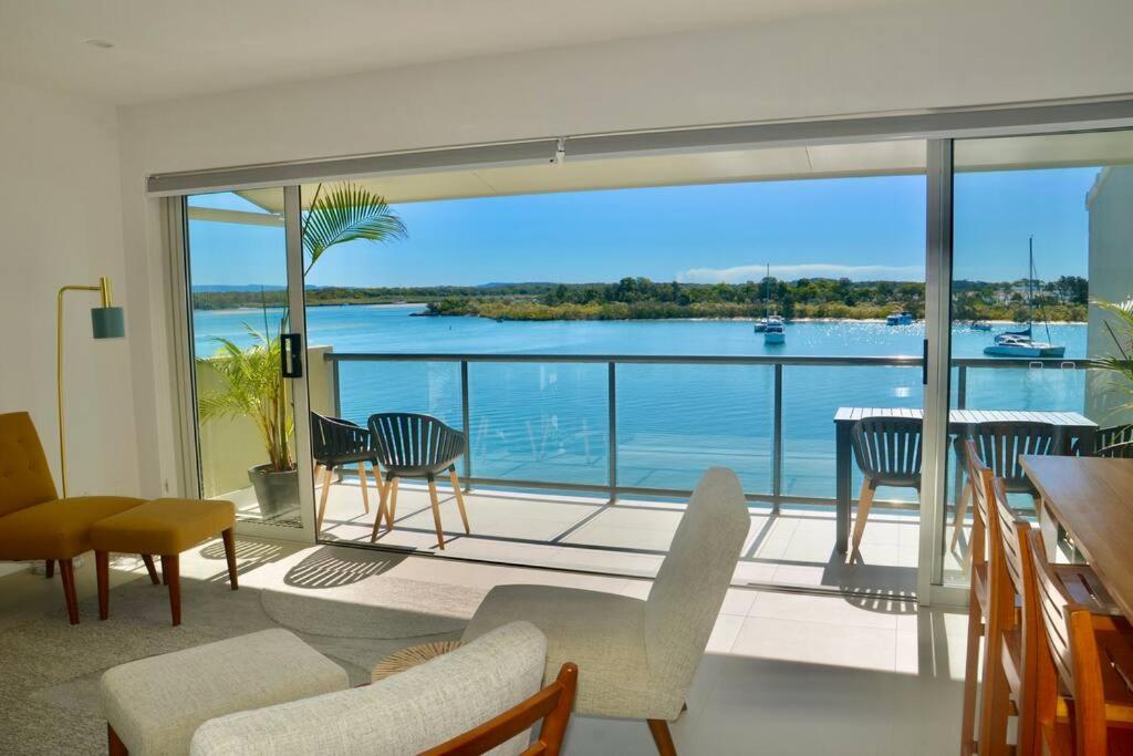 a living room with a view of the water at Noosa Shores apt 29-Noosa Heads-near Hastings St in Noosa Heads