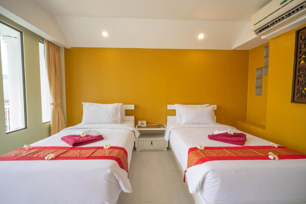 Postel nebo postele na pokoji v ubytování La Vintage Resort - Patong, Phuket