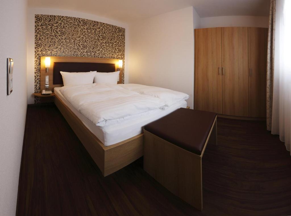 Postel nebo postele na pokoji v ubytování Hotel Fortuna