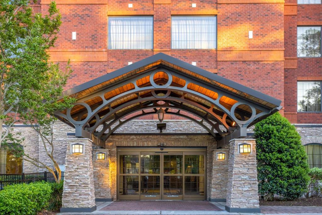 a building with an arch over the door at Staybridge Suites Wilmington East, an IHG Hotel in Wilmington
