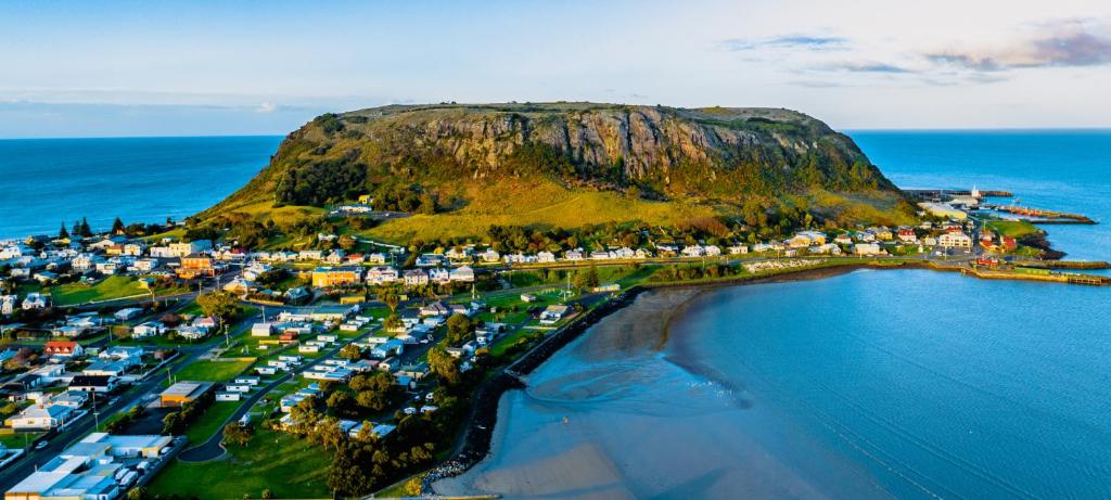 an aerial view of a small island in the ocean at BIG4 Stanley Holiday Park in Stanley