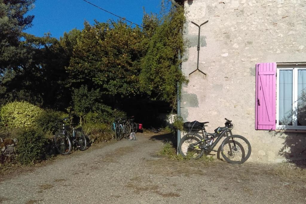 a group of bikes parked next to a building at Les Glycines in Saint-Pierre-de-Buzet