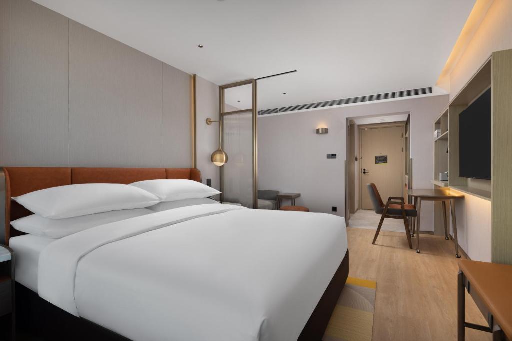 Postel nebo postele na pokoji v ubytování Home2 Suites by Hilton Beijing West Station
