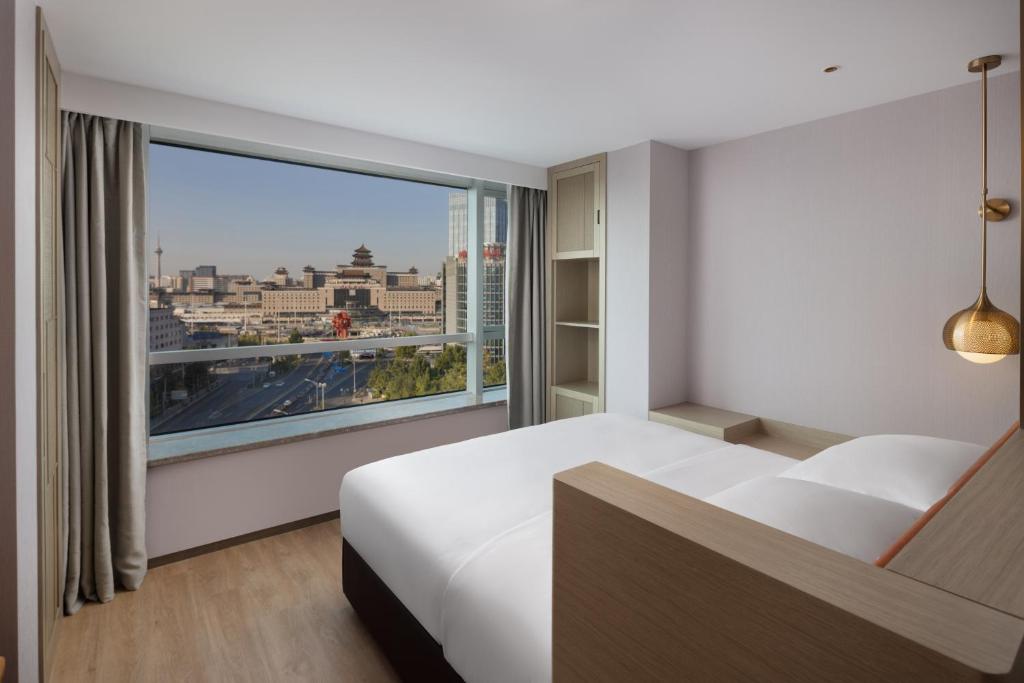 Postel nebo postele na pokoji v ubytování Home2 Suites by Hilton Beijing West Station