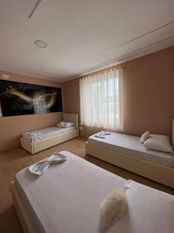Postel nebo postele na pokoji v ubytování MIQT GUEST HOUSE