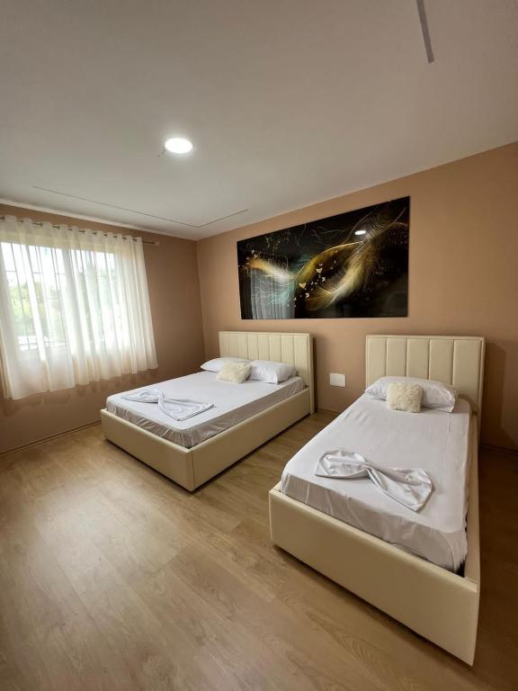 Postel nebo postele na pokoji v ubytování MIQT GUEST HOUSE