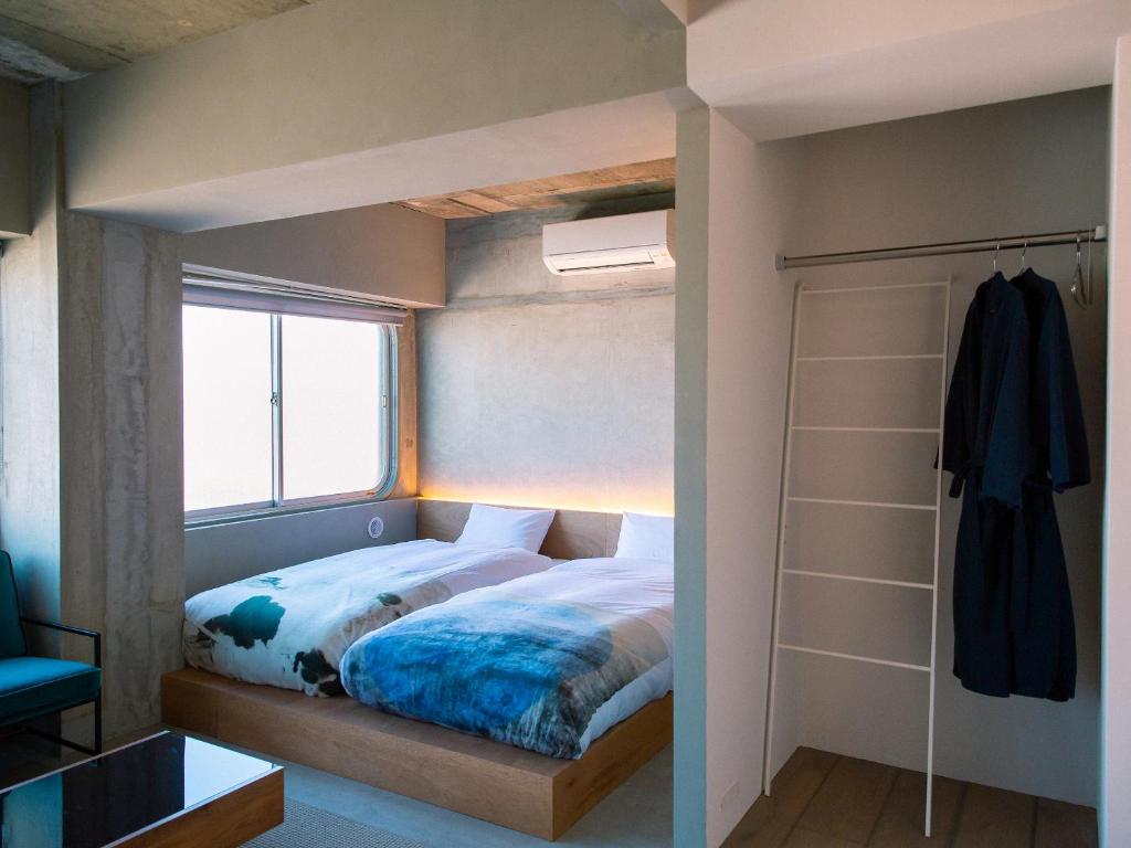Postel nebo postele na pokoji v ubytování Kagan Hotel & Hostel