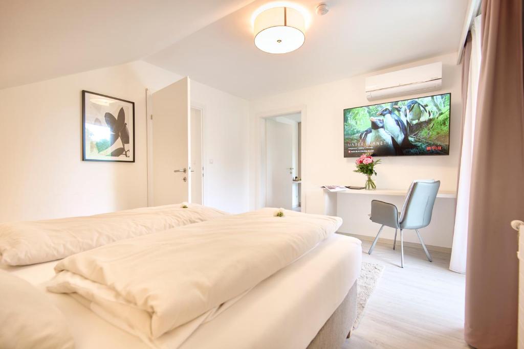TV/trung tâm giải trí tại Pension - Ferienwohnungen Zollner