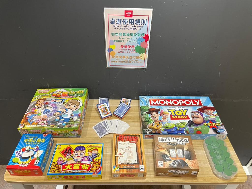 a table with many games on top of it at Yomi Hotel - ShuangLian MRT in Taipei