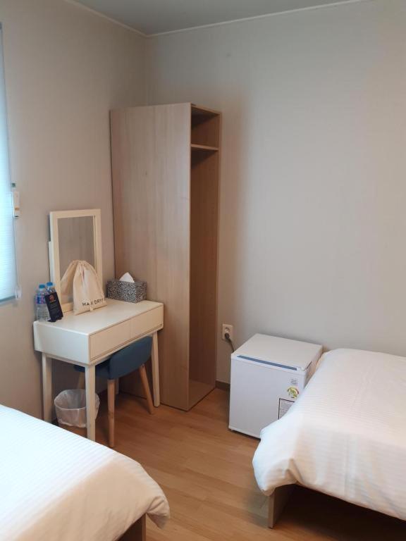Postel nebo postele na pokoji v ubytování Uniqstay