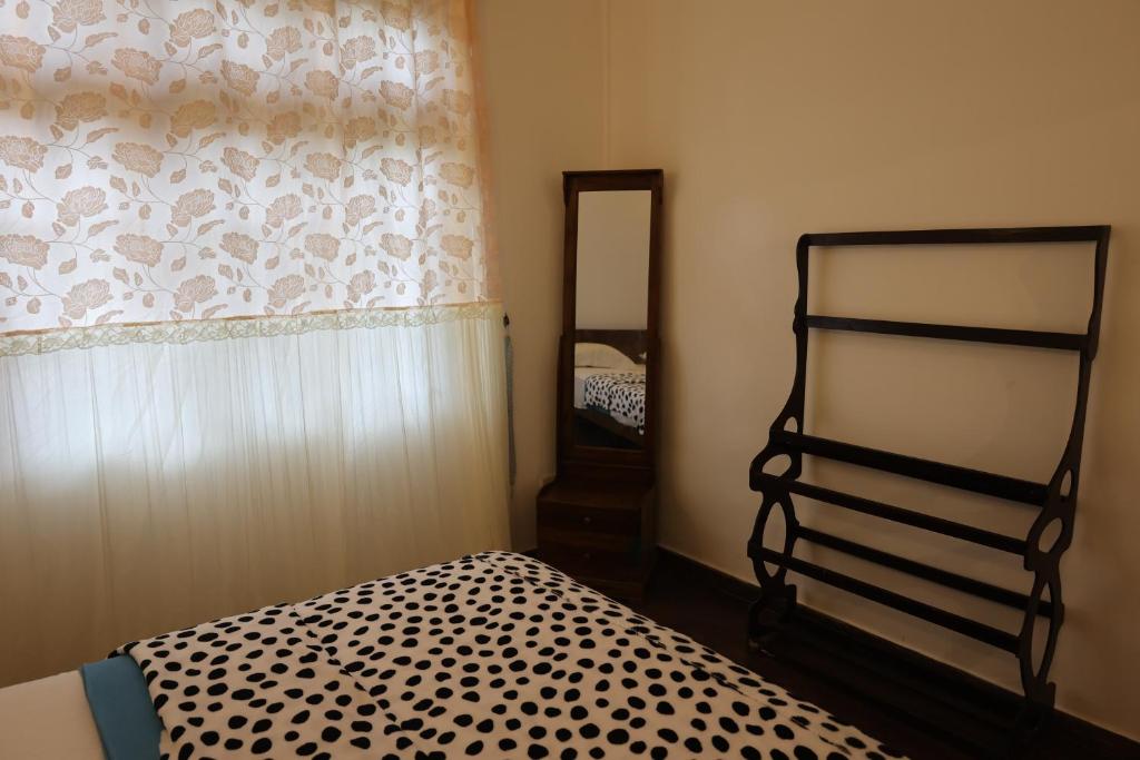 Postel nebo postele na pokoji v ubytování Paramount Hotel Pussellawa