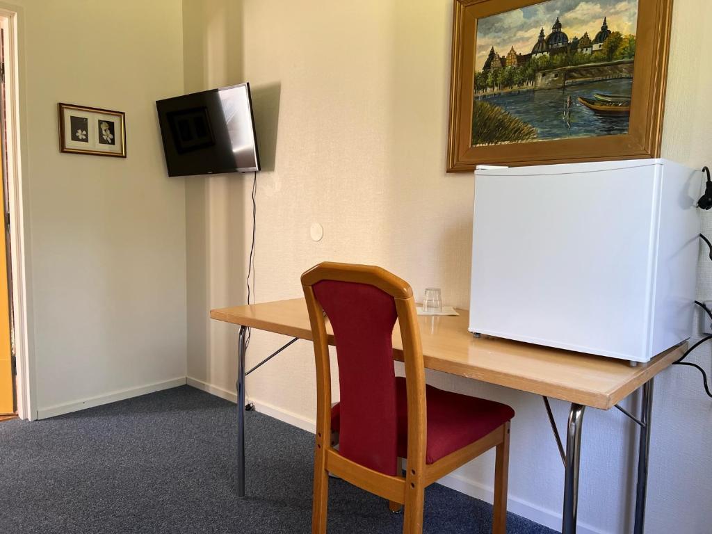 TV a/nebo společenská místnost v ubytování Nadden Hotell & Konferens