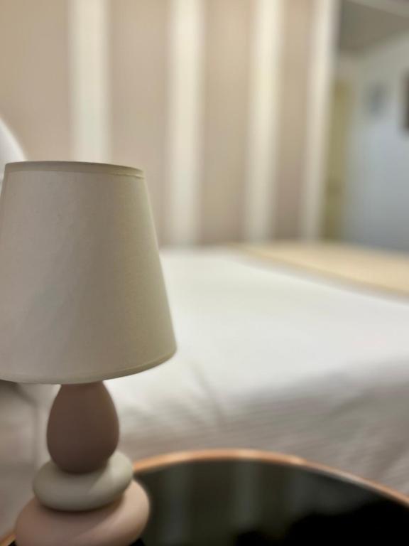 A bed or beds in a room at Relais Ponte Pietra