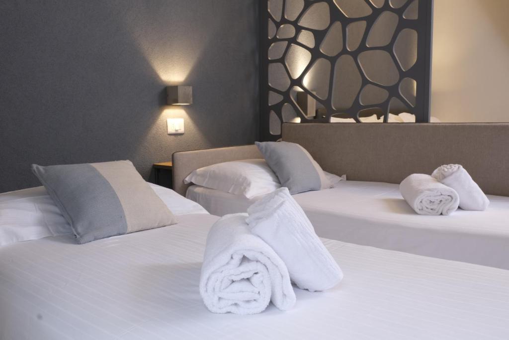 Postel nebo postele na pokoji v ubytování Hotel Stella Del Mare