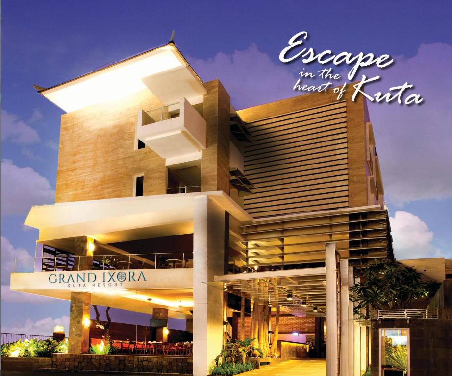 a building with a sign that reads escape in the heart of kuta at Grand Ixora Kuta Resort in Kuta