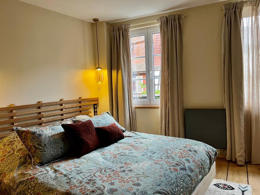 Postel nebo postele na pokoji v ubytování Logement cocooning à Barr