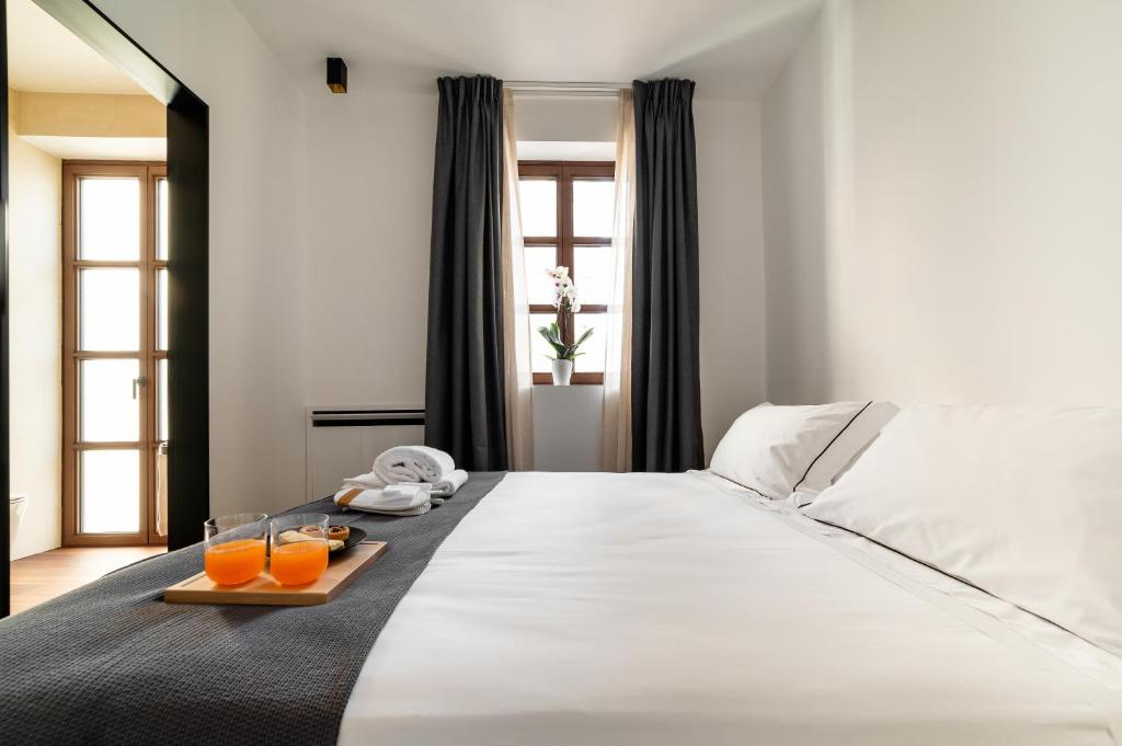 Postel nebo postele na pokoji v ubytování Arringo - Stay comfy