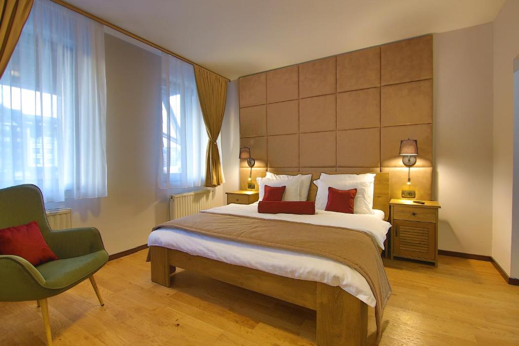 Postel nebo postele na pokoji v ubytování Hotel Olimp