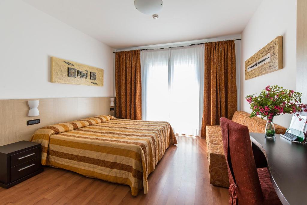 Postel nebo postele na pokoji v ubytování Hotel Olympus