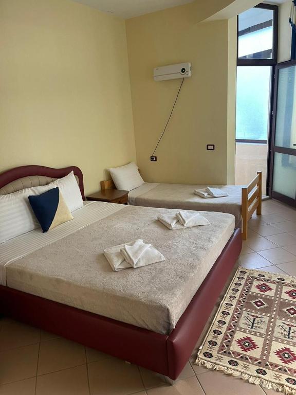 Postel nebo postele na pokoji v ubytování Hotel Saint Marena