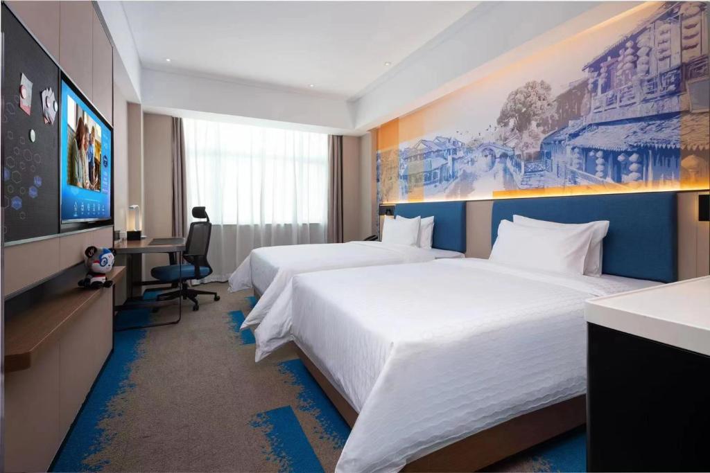 Postel nebo postele na pokoji v ubytování Hampton by Hilton Hangzhou West Lake