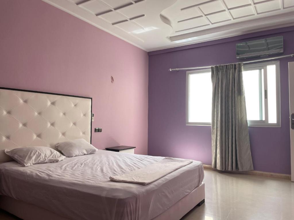 Postel nebo postele na pokoji v ubytování Darcom Apartments