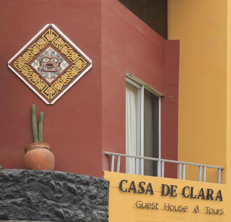a sign on the side of a building at Casa de Clara in Trujillo
