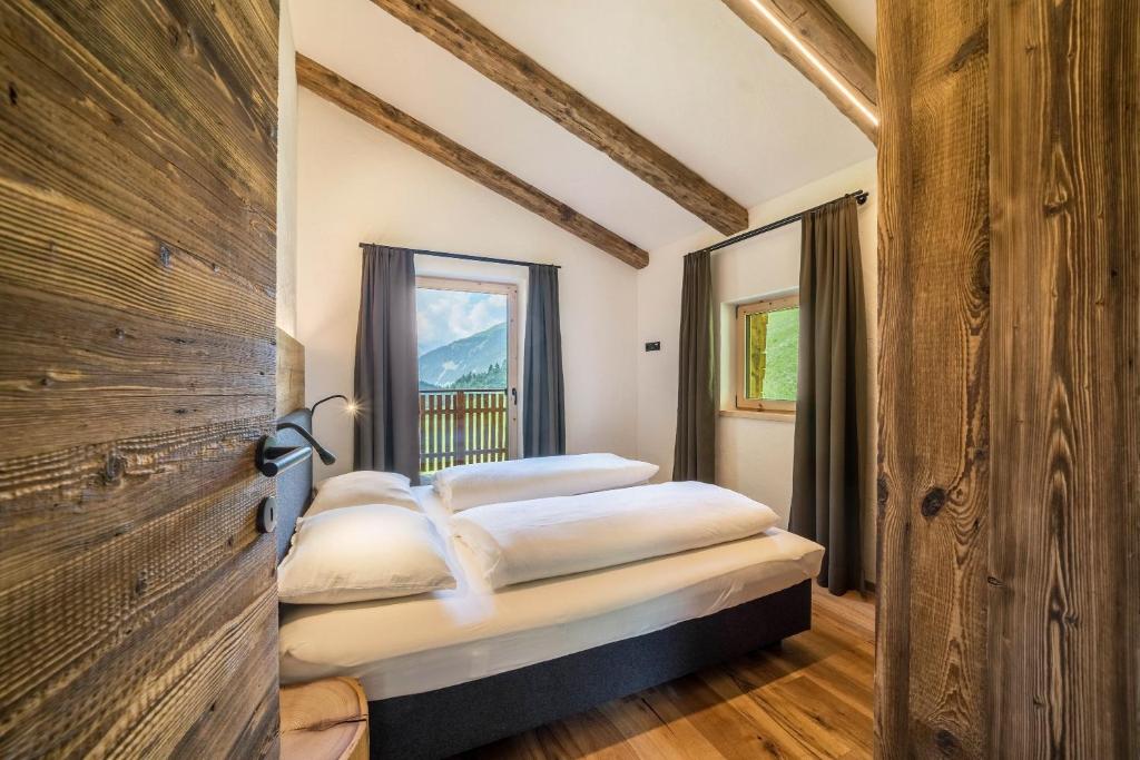 Postel nebo postele na pokoji v ubytování Chalet zu Wosser