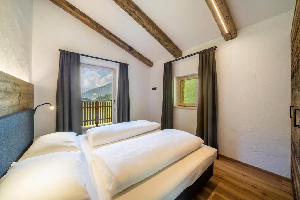 Postel nebo postele na pokoji v ubytování Chalet zu Wosser