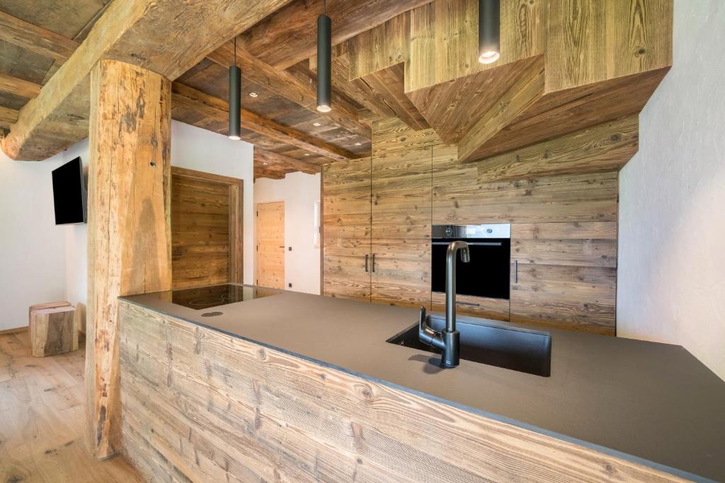 TV a/nebo společenská místnost v ubytování Chalet zu Wosser