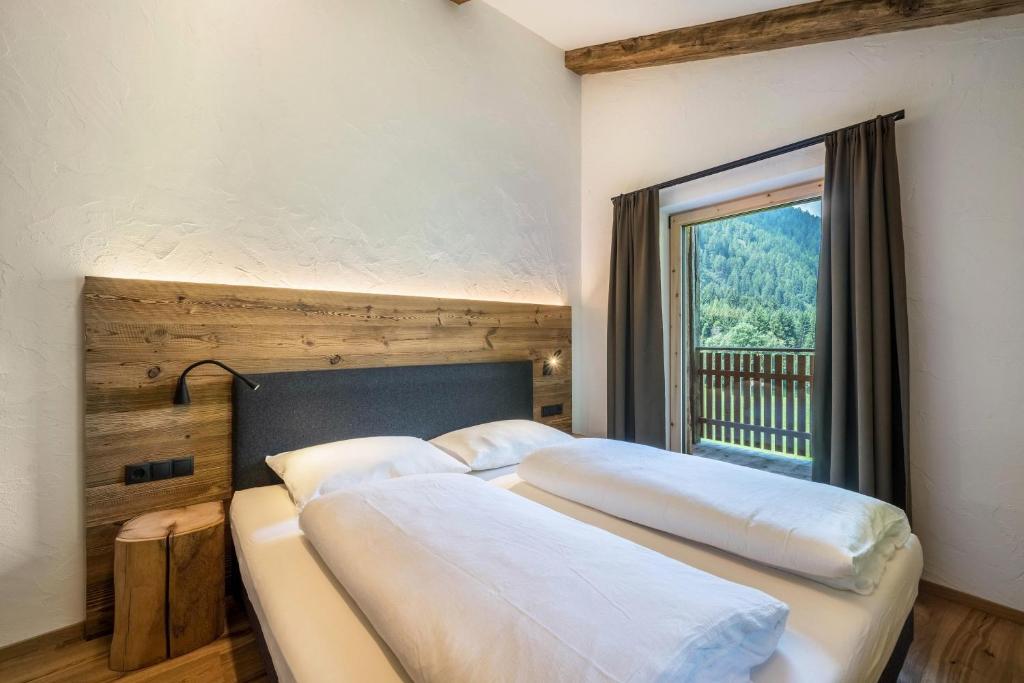 Postel nebo postele na pokoji v ubytování Chalet zu Wosser
