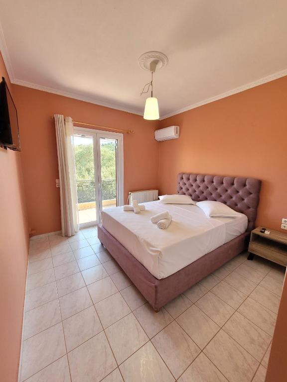 Postel nebo postele na pokoji v ubytování The View Point Apartment Lefkada