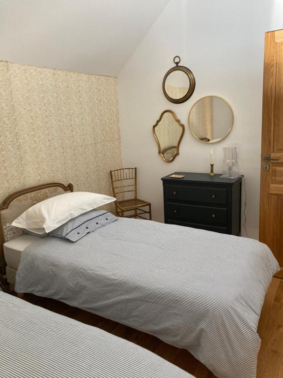 Postel nebo postele na pokoji v ubytování Maison à Pornichet