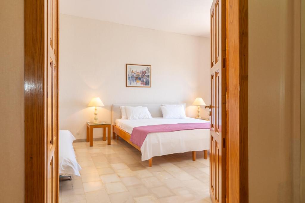 Postel nebo postele na pokoji v ubytování Hotel Elman