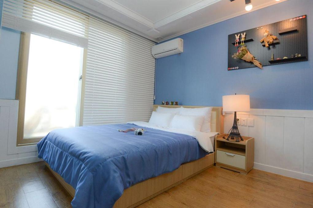 Postel nebo postele na pokoji v ubytování Suncheon Bay Healing Pension
