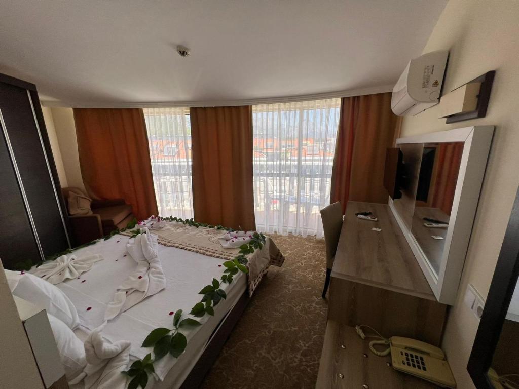 Postel nebo postele na pokoji v ubytování RK MAGİC DREAM HOTEL