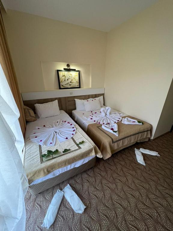 Postel nebo postele na pokoji v ubytování RK MAGİC DREAM HOTEL