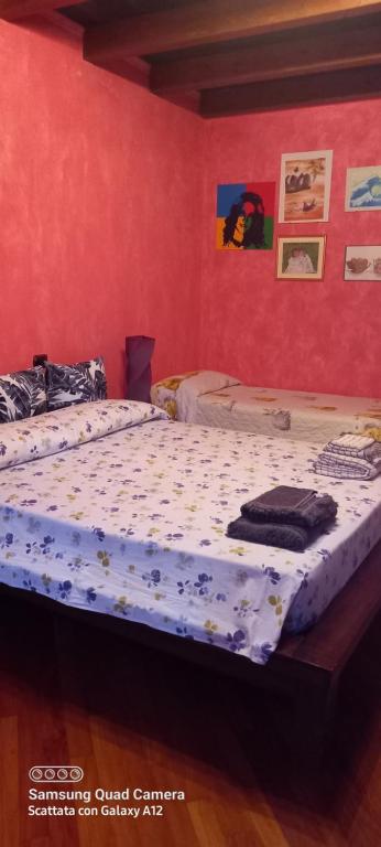 Säng eller sängar i ett rum på Affascinante Villino