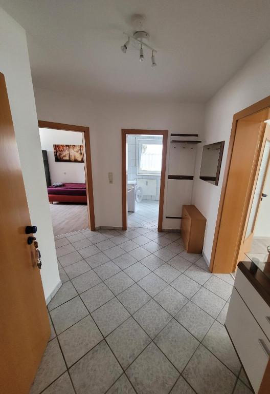 a view of a kitchen from the living room at Ferienwohnung Unterneukirchen mit Garten-Terrasse in Unterneukirchen
