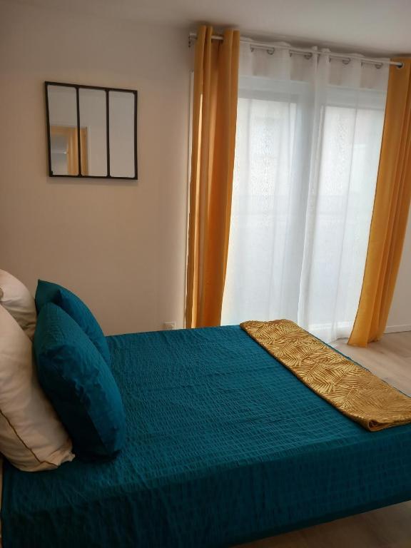 Postel nebo postele na pokoji v ubytování Les gîtes Ambleteuse