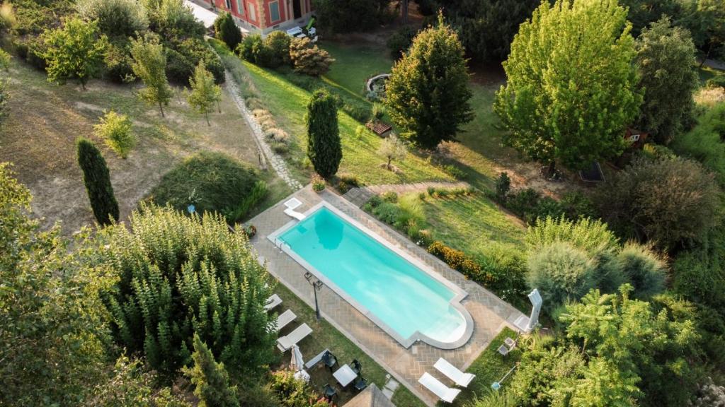 an overhead view of a swimming pool in a garden at Cascina Solaro in Asti