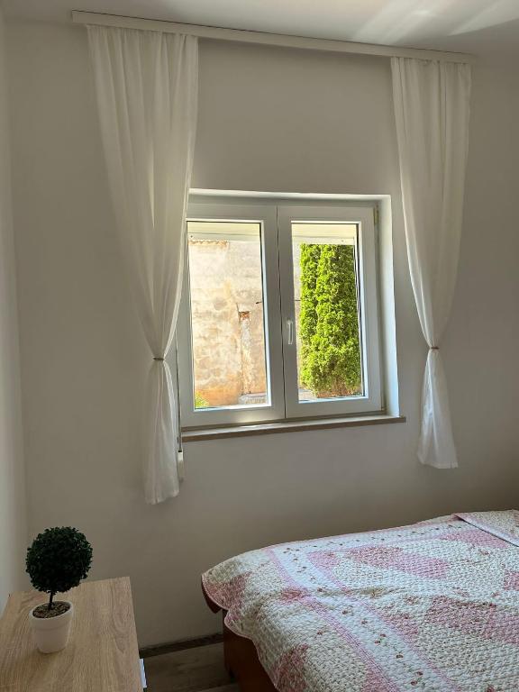 Postel nebo postele na pokoji v ubytování Apartments A&R