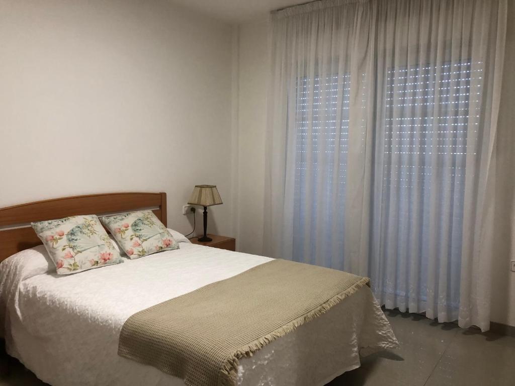 Postel nebo postele na pokoji v ubytování Apartamentos Raxo Mar