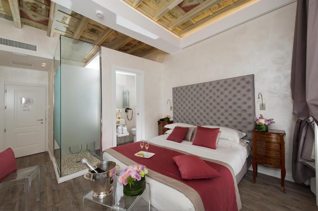 Postel nebo postele na pokoji v ubytování Hotel Navona